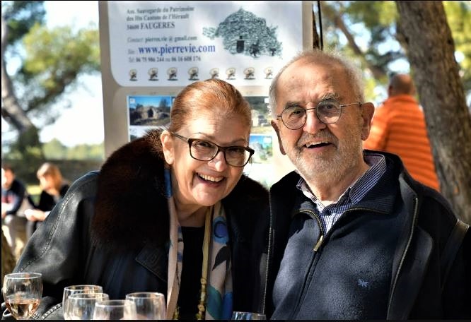 Eleni at feast (in 2019 with Agustin at Saumane, France, celebration of the UNESCO inscription)